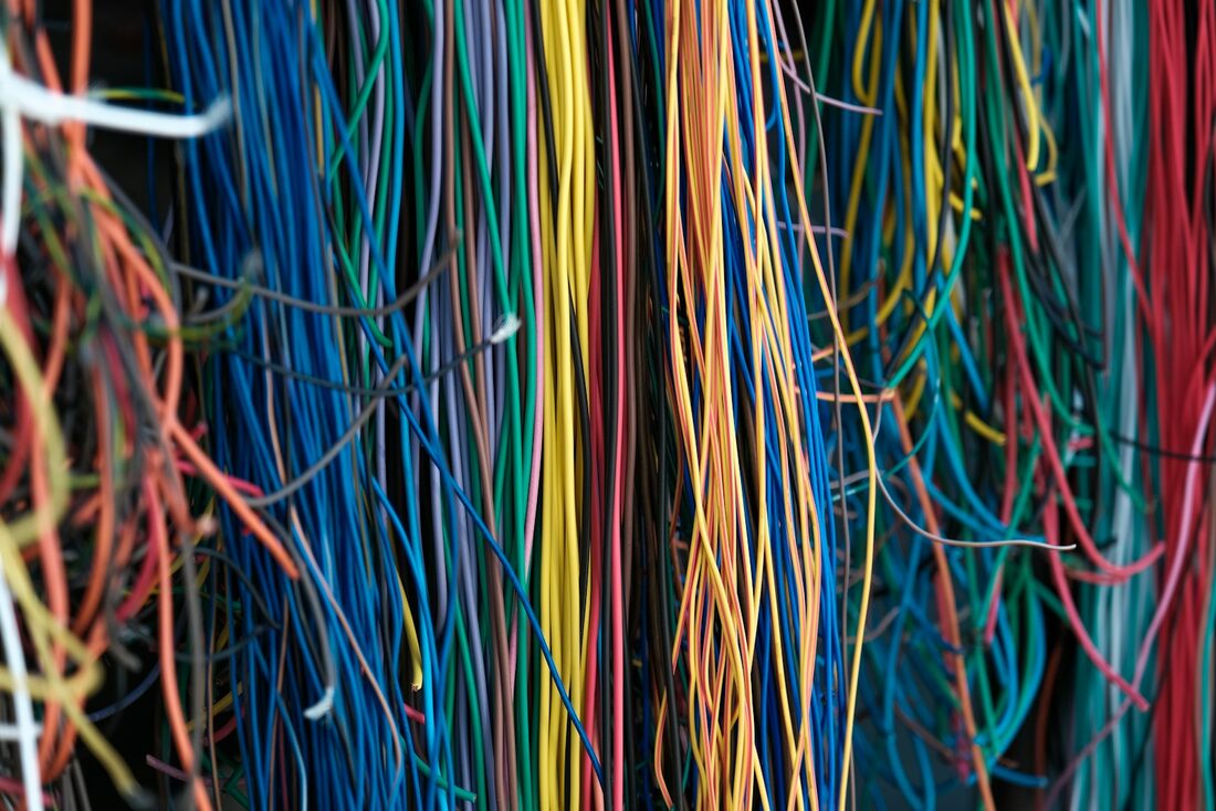 Bundled electrical cabling running through a property
